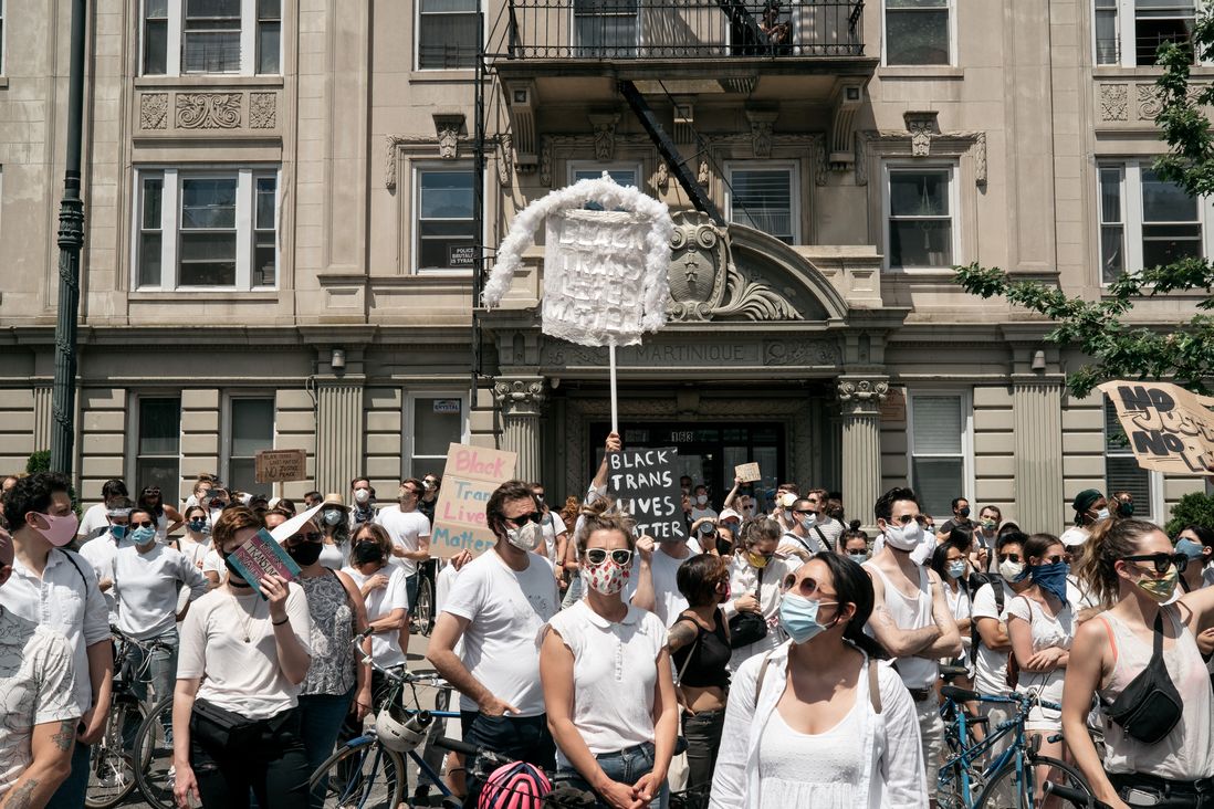 A large crowd of protesters dressed in white gather in Brooklyn to support the rights of transgender people of color.